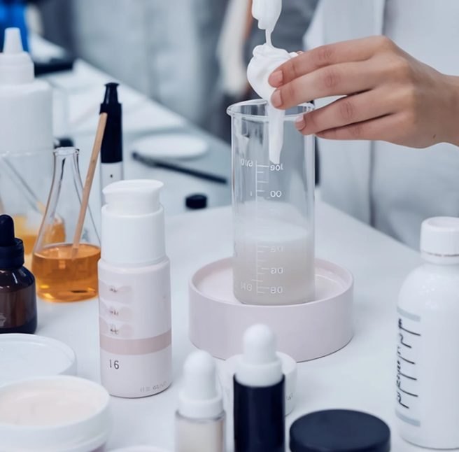 Cream texture and bottle samples on the formulation bench